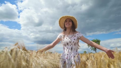 Girl Walking on Barley Field