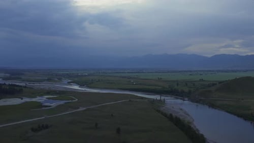 Aerial of majestic river Katun and valley of Altai under sunset sky