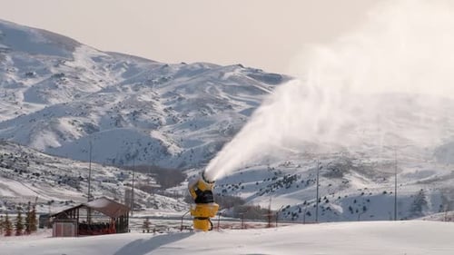 Snow Cannon Making Artificial Snow on Mountain Side