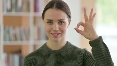 Smiling Woman Giving Okay Hand Gesture