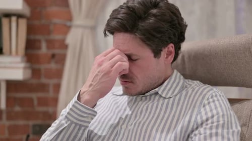 Portrait of Middle Aged Man having Headache at Home