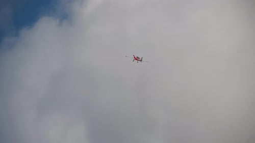 Stunning Aerial View of Stunt Plane Releasing Smoke