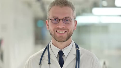Doctor Smiling in Hospital Setting Close Up