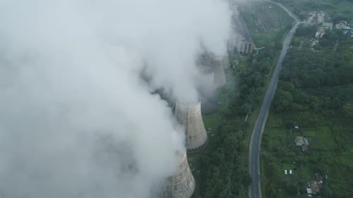 Aerial Drone View of Smoking Pipes and Cooling Towers of Coal Thermal Power Plant