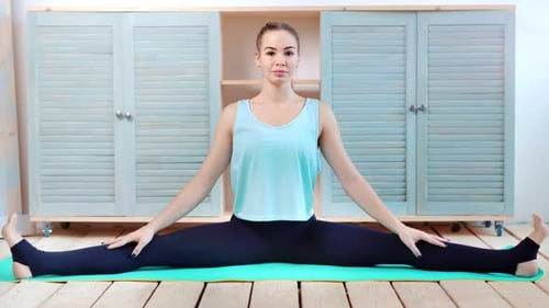 Confident Stretching Young Woman Sitting on Mat in Twine Full Shot Asana Yoga Namaste