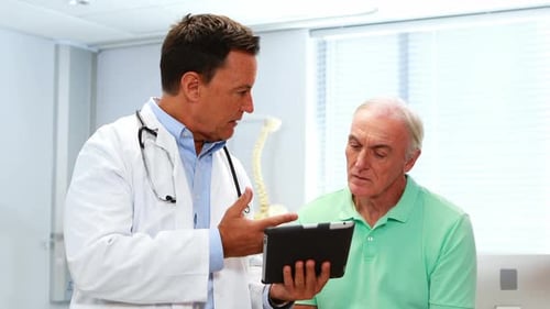 Doctor Explains Digital Chart to Senior Patient