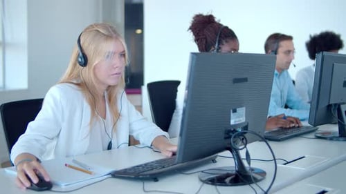 Row Call Center Operators Using Computers