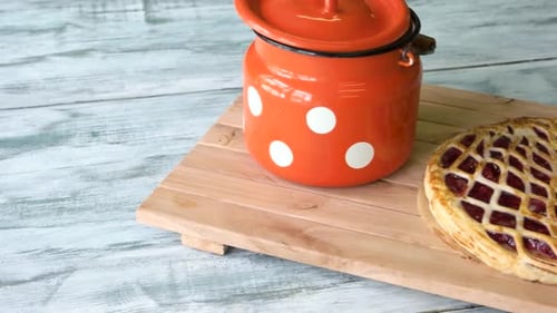 Overhead of Cherry Pie on Wooden Board