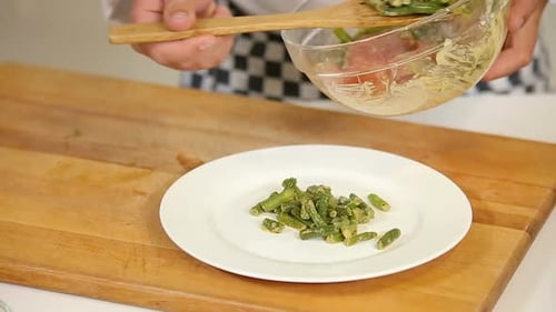 Cooking Warm Salad with Green Beans and Salami Slices