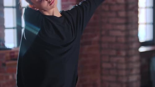 Woman Dancing and Stretching in Fitness Studio