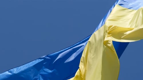 Ukraine Flag Waving Against Clear Blue Sky