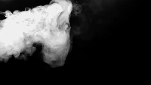 Billowing White Smoke on a Black Background
