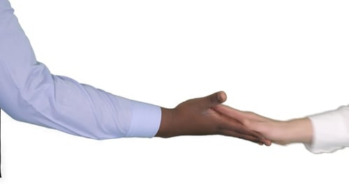 Hands Reaching Across a White Background to Grasp