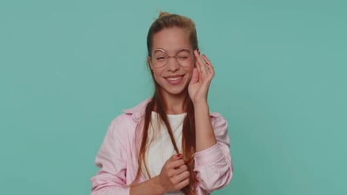 Smiling Playful Happy Girl Blinking Eye Looking at Camera with Smile Winking Flirting Optimism