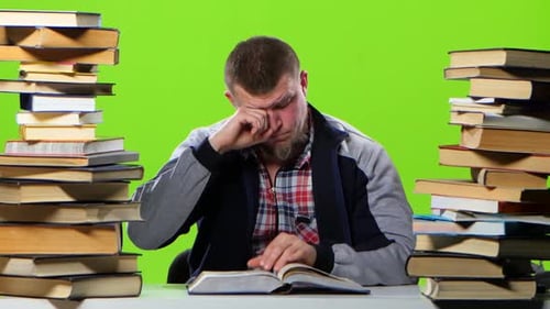 Man Sitting at the Table Begins To Fill Up. Green Screen