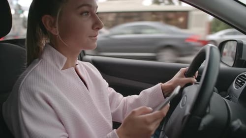 Woman Driving and Texting