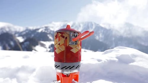 Camping Stove in Snowy Mountains
