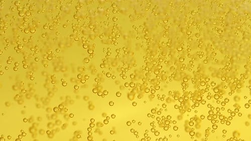 Glass of beer with bubbles.