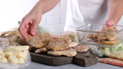 Woman Meal Prepping Food for the Freezer
