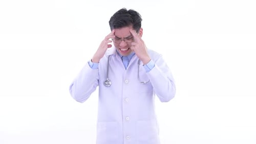 Stressed Young Doctor Rubbing Temples