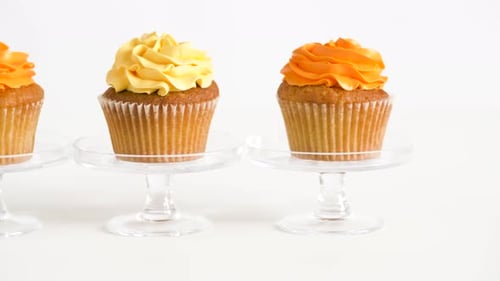 Colorful Frosted Cupcakes on Display Stands