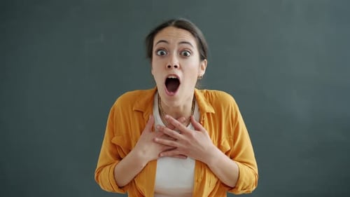 Slow Motion of Surprised Young Lady Screaming Yes and Expressing Excitement and Joy