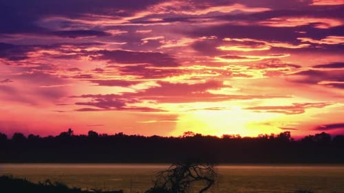 Timelapse of a Beautiful Red and Golden Sunset Over the Lake