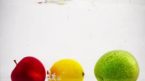 Colorful Fruits Plunging into Refreshing Water