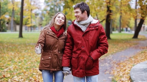Happy Young Couple Walking In Autumn Park 3