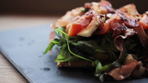 Prosciutto Ham Salad On Stone Plate At Restaurant 34