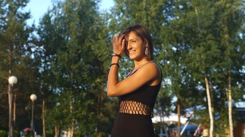 Woman Smiling and Posing in Green Park