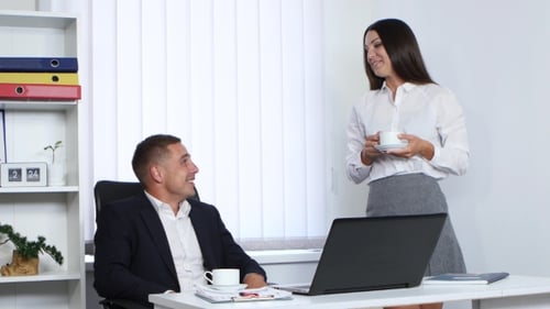 Business Meeting with Coffee in Modern Office