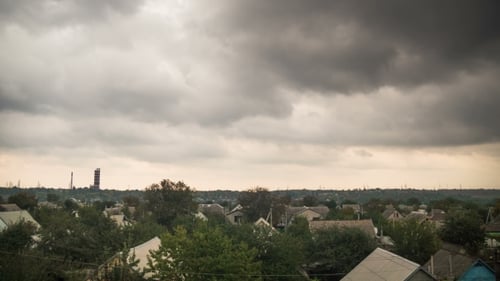 Storm Clouds In The Sky Moving Over The Houses In The City