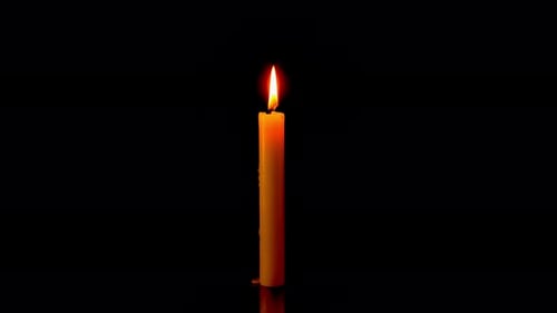Single Candle Burns Brightly in the Darkness