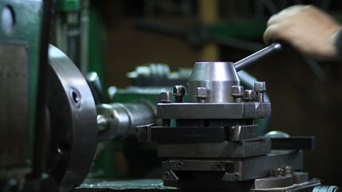 Operator Working At Old Lathe Machine