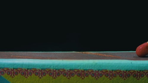 Wooden Match Ignites Striking Against Matchbox Surface