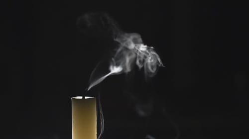 Glowing Candle Burns and Snuffs Out in Darkness
