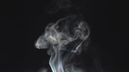 Abstract Wispy Smoke Rising on Black Background