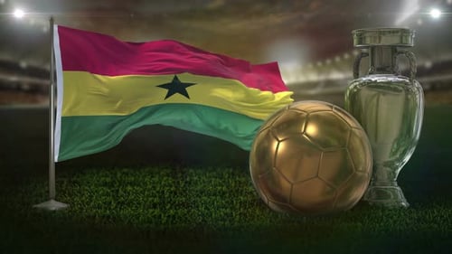 Waving Ghana Flag, Golden Football, and Silver Trophy on Soccer Field