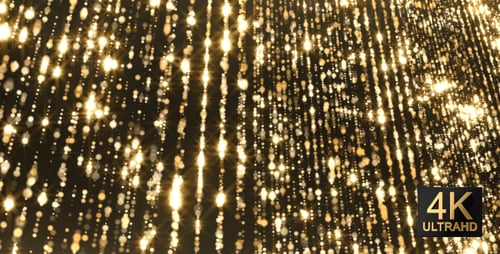 Goldfarbene funkelnde Lichtpartikel