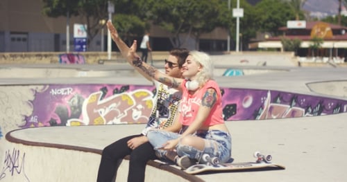 Couple at Skate Park Hanging Out Together