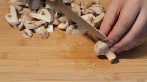 Slicing Mushrooms on Cutting Board Food Preparation Close-up