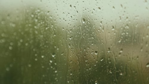 The Raindrops Flowing On Glass Windows In Rainy Weather 2
