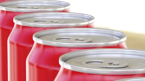 Red Soda Cans Moving Continuously in a Row
