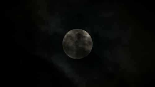 Full Moon Shines Brightly Through Dark Night Sky