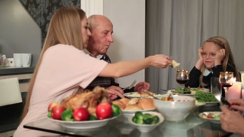 Family Enjoys a Meal Together at Home
