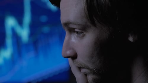 Businessman In The Office Working Late At Night And Having a Bad Headache