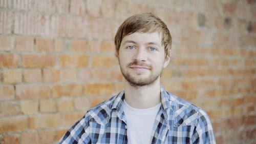 Man Smiling and Giving OK Hand Gesture