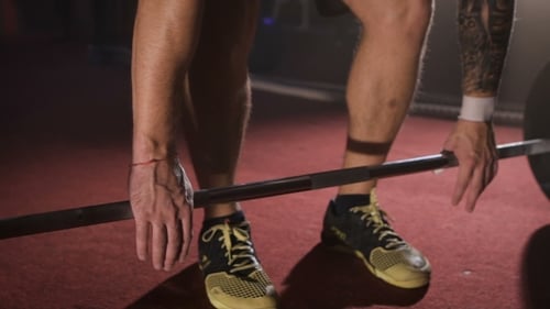 Athlete Taking And Lifting The Barbell At The Gym.