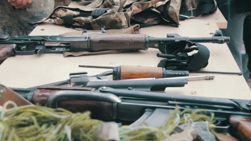 Rifles Disassembled on Table, Military Theme